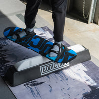 top down of Guy jibbing on the snowboard addiction jib board essentials