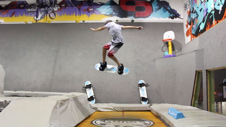How To Shifty 180 On A Tramp Board - Snowboard Addiction