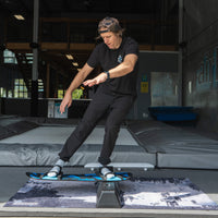 Guy jibbing on the snowboard addiction jib board essentials